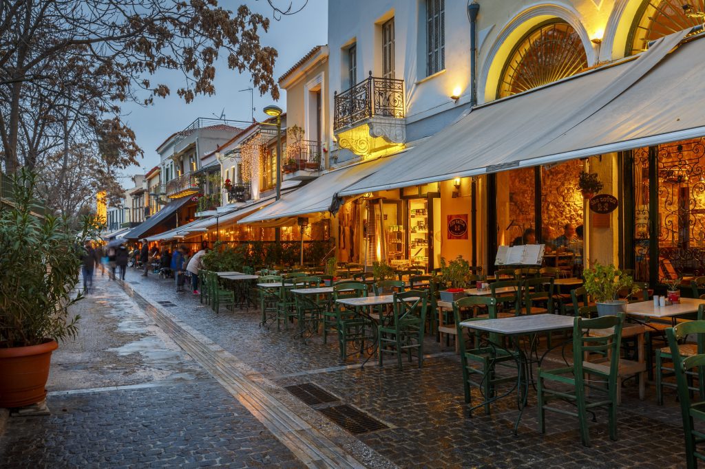 Coffee shops and restaurants in the main square of Lefkada town — Photo by Cavan