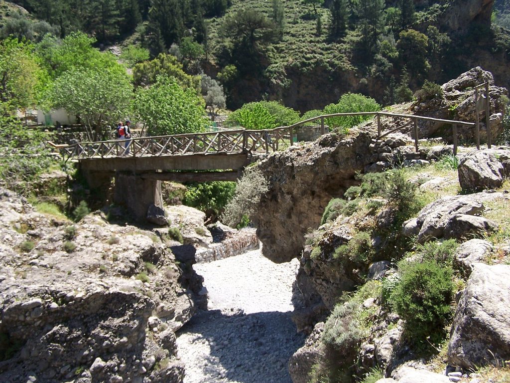 Hikers crossing a bridge at the Samaria Gorge. 