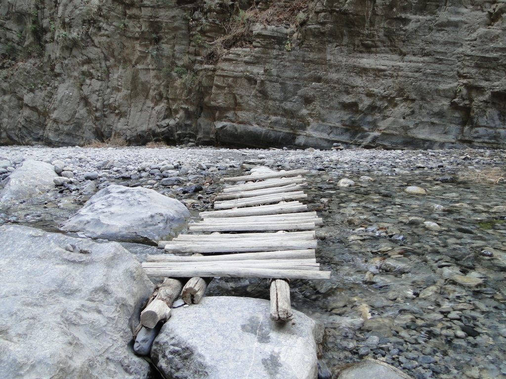 A wooden bridge over a small creek at the Samaria Gorge. 