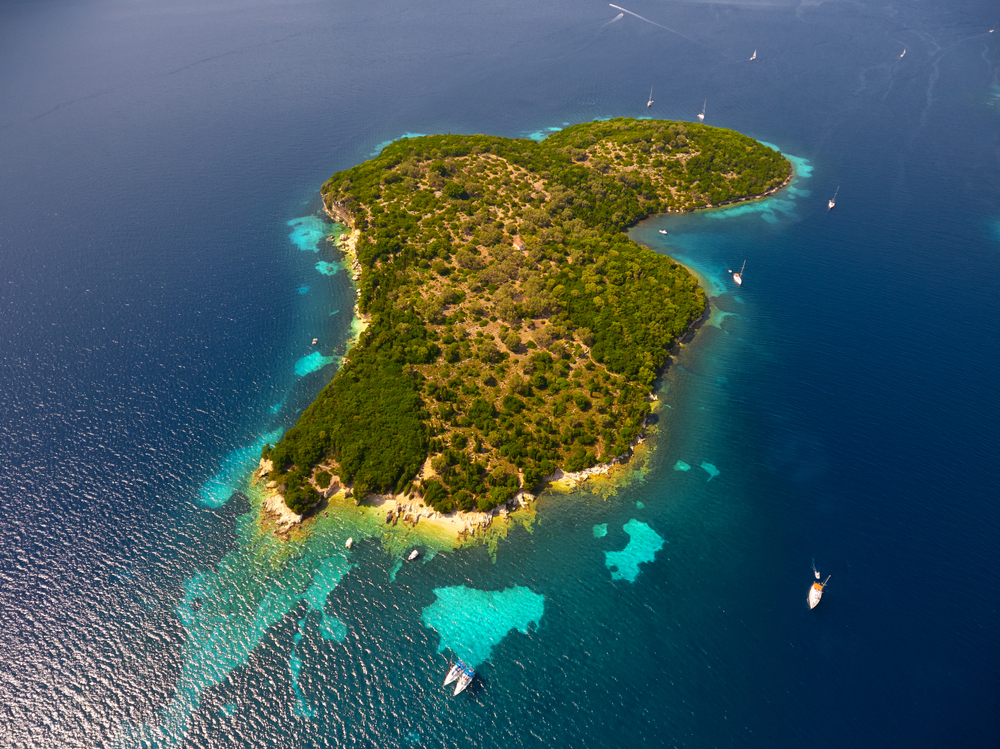 Above little Thilia island in Greece (between Lefkada island and Meganisi island). Drone photography - jordeangelovic / shutterstock