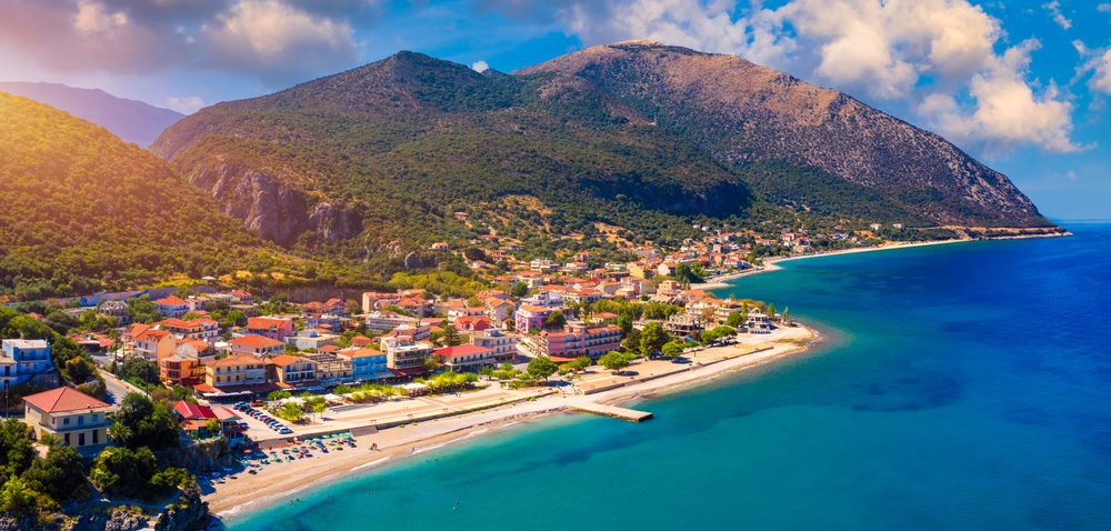 Aerial view of city of Poros, Kefalonia island in Greece. Poros city in middle of the day. Cephalonia or Kefalonia island, Ionian Sea, Greece. Poros village, Kefalonia island, Ionian islands, Greece -DaLiu / shutterstock