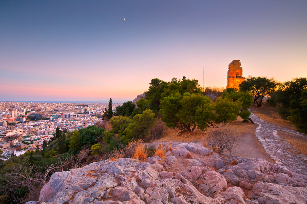 Philopappos Monument and view of Athens from Filopappou hill, Greece - Milan Gonda / shutterstock